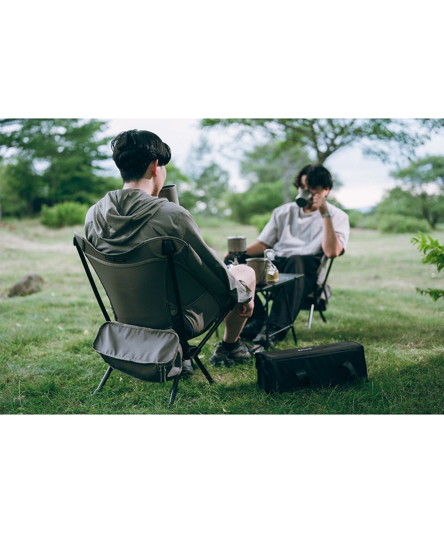 Snow Peak × Helinox lightweight folding camping chair with black aluminum frame and greige seat