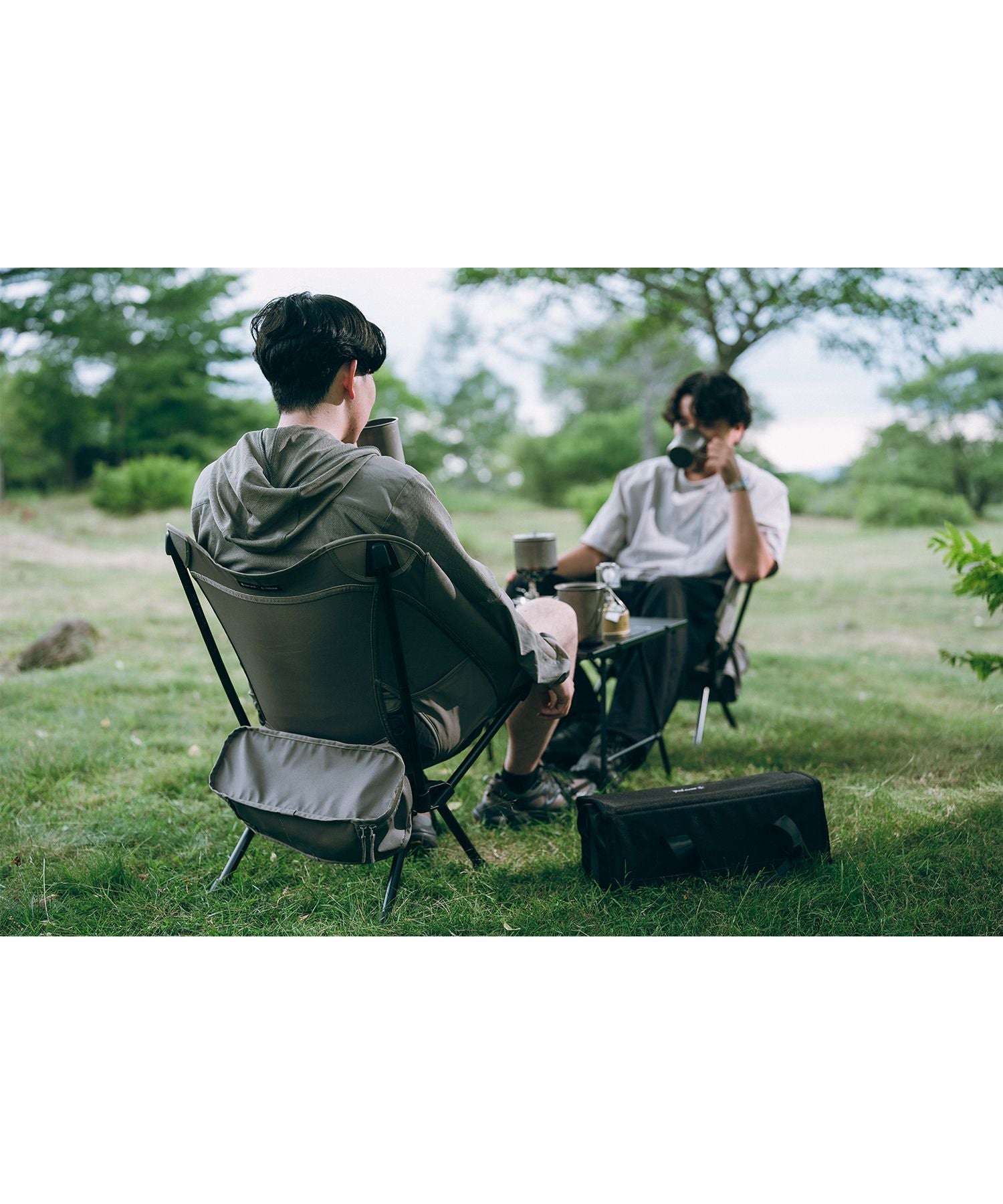 Snow Peak × Helinox lightweight folding camping chair with black aluminum frame and greige seat