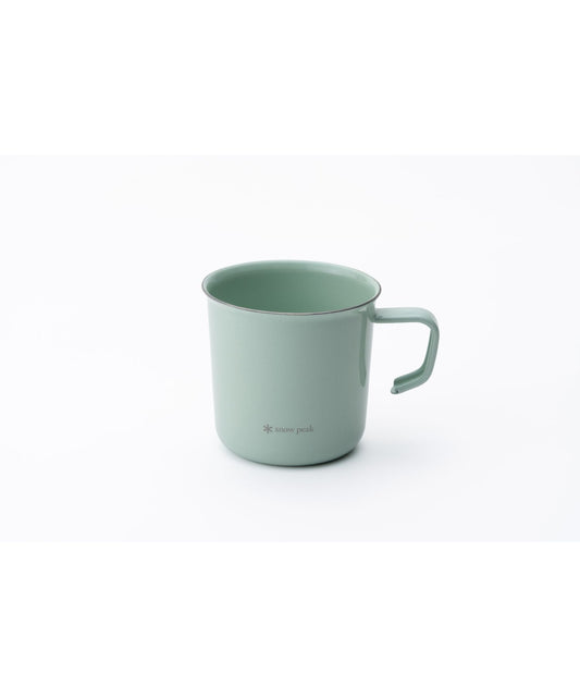 Green mug on a white background